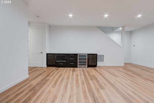 bar featuring wine cooler, recessed lighting, light wood-style flooring, and visible vents