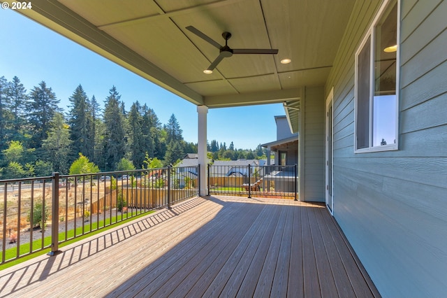 wooden terrace featuring ceiling fan