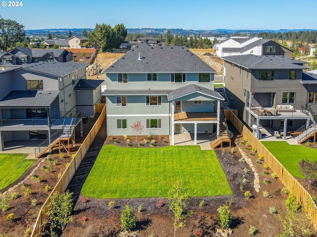 birds eye view of property with a residential view