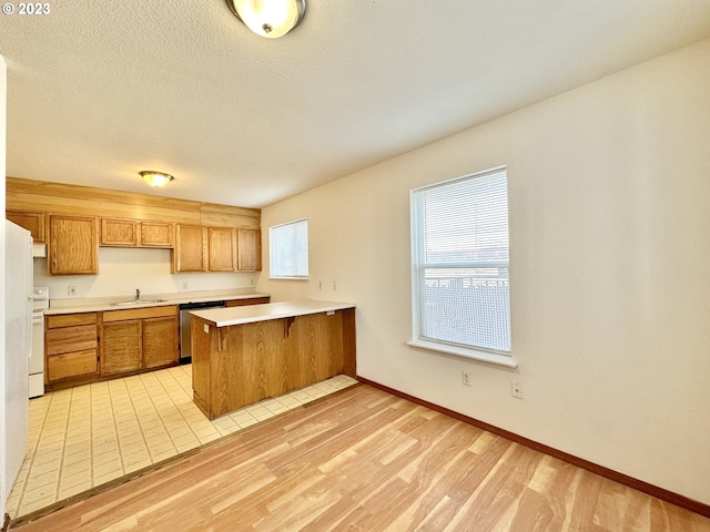 kitchen featuring kitchen peninsula, light tile floors, sink, dishwasher, and white electric range oven