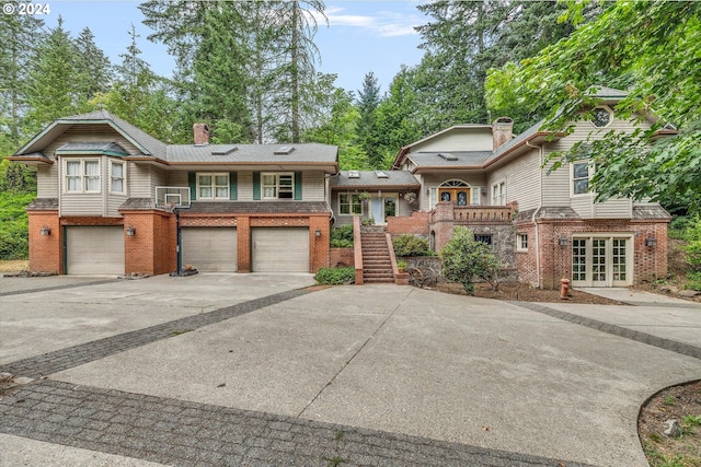 view of front facade featuring a garage and french doors