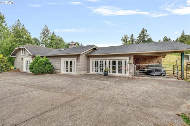 rear view of house featuring french doors