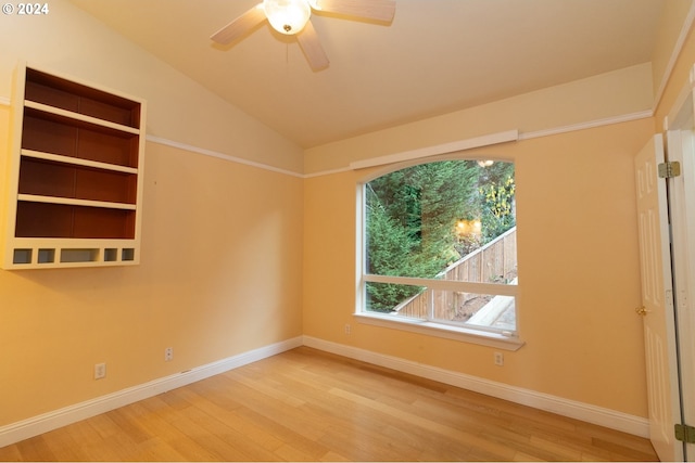 unfurnished room featuring hardwood / wood-style flooring, ceiling fan, and lofted ceiling