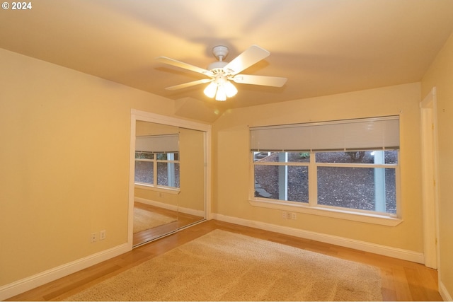 unfurnished room with ceiling fan and hardwood / wood-style floors