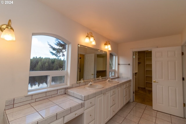 bathroom with tile patterned floors and vanity