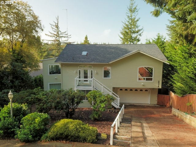 88378 Collard Lake Rd, Florence, OR 97439 - view of front of home featuring concrete driveway, stairs, an attached garage, and a shingled roof