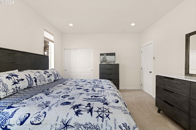 bedroom featuring light colored carpet, recessed lighting, and baseboards