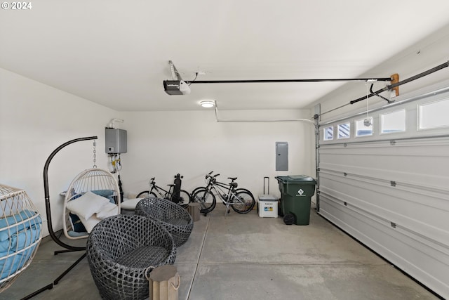 garage with a garage door opener and electric panel