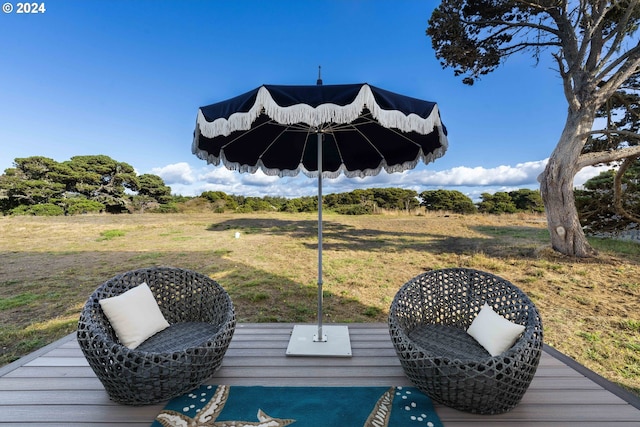 wooden deck featuring a yard