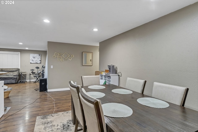 dining space featuring wood-type flooring