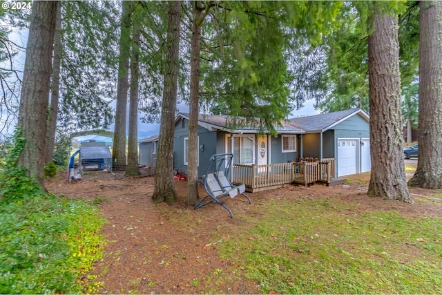 view of front of house featuring covered porch and a garage