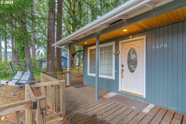 entrance to property with a wooden deck