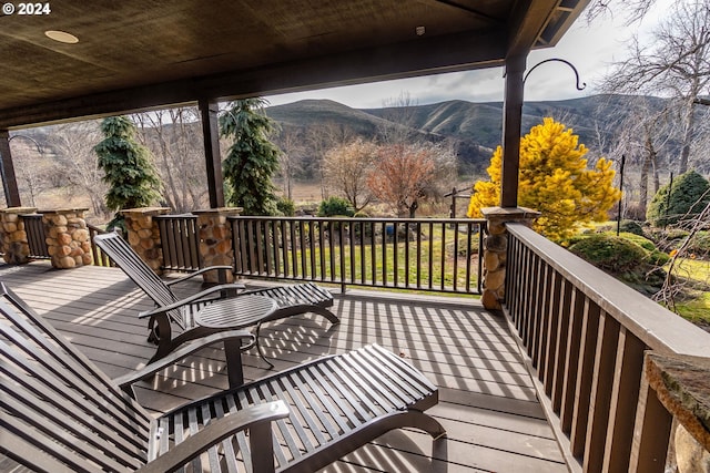 wooden terrace featuring a mountain view