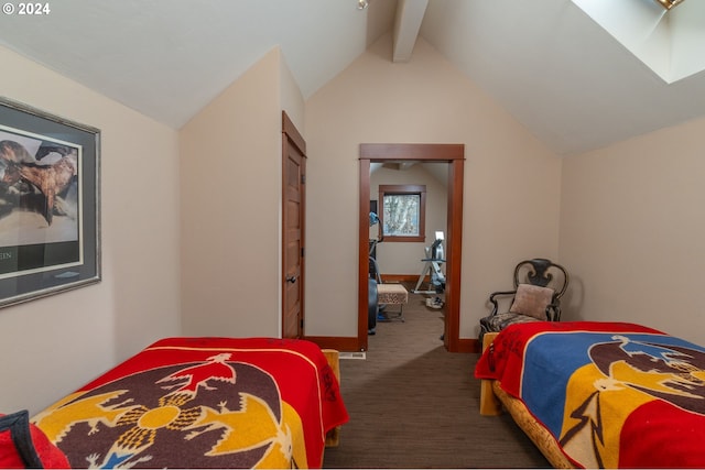 bedroom featuring dark colored carpet and lofted ceiling with skylight