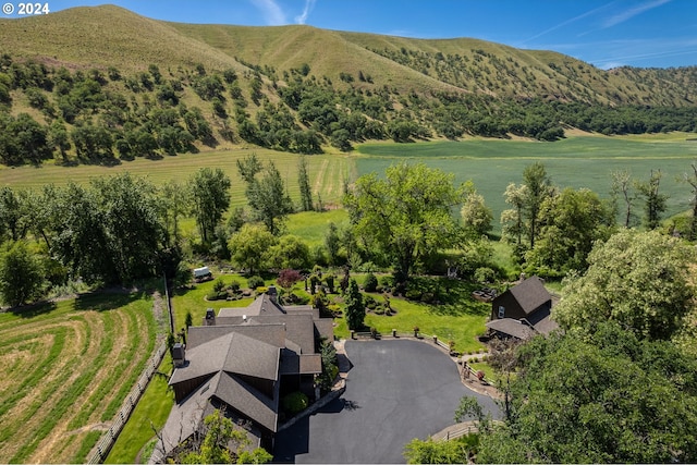 birds eye view of property featuring a mountain view