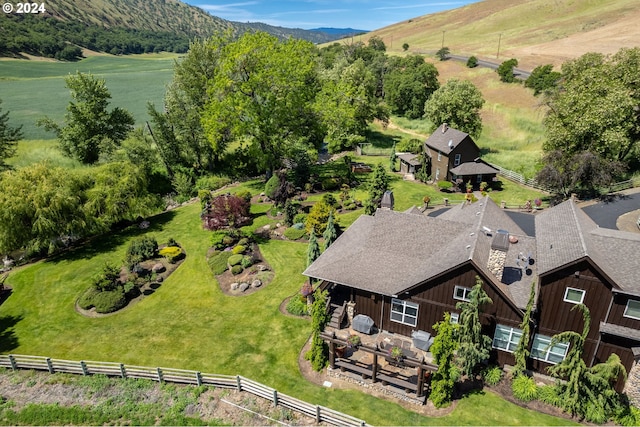 birds eye view of property with a mountain view