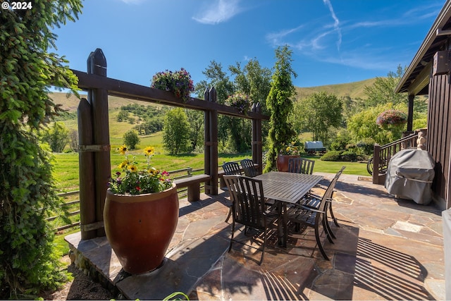 view of patio / terrace featuring a mountain view