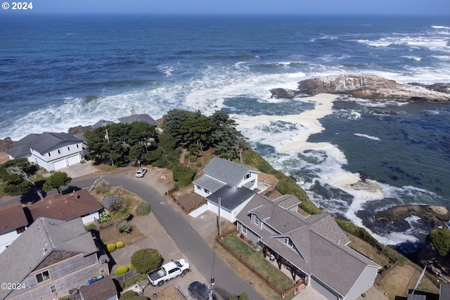 aerial view with a water view and a view of the beach