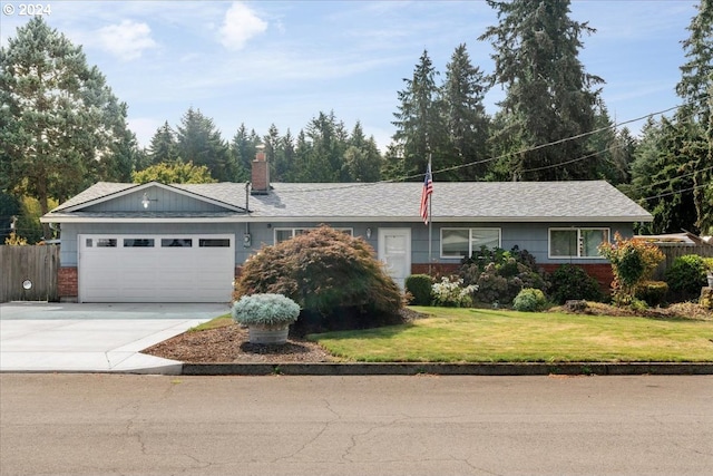 ranch-style house with a front yard and a garage