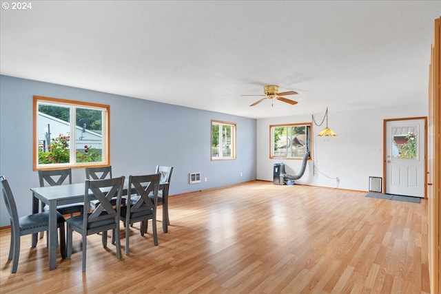 dining space featuring ceiling fan and light hardwood / wood-style floors