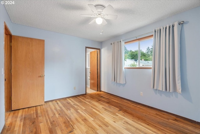 interior space featuring a textured ceiling, ceiling fan, and light hardwood / wood-style floors