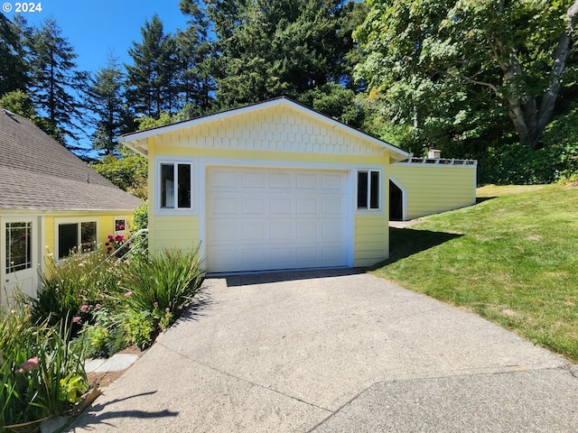 garage featuring a yard