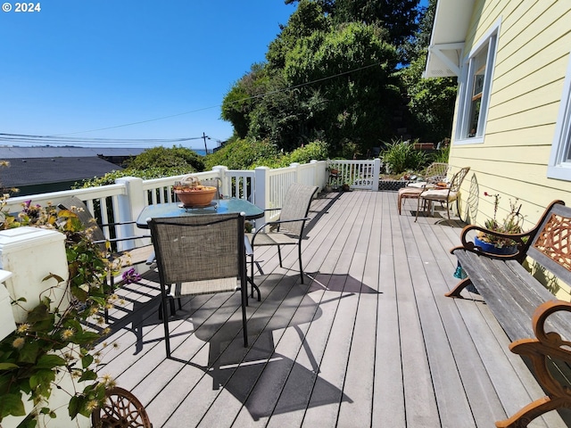 deck with outdoor dining area