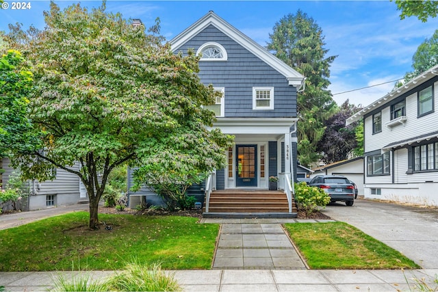 view of front of property with a front lawn