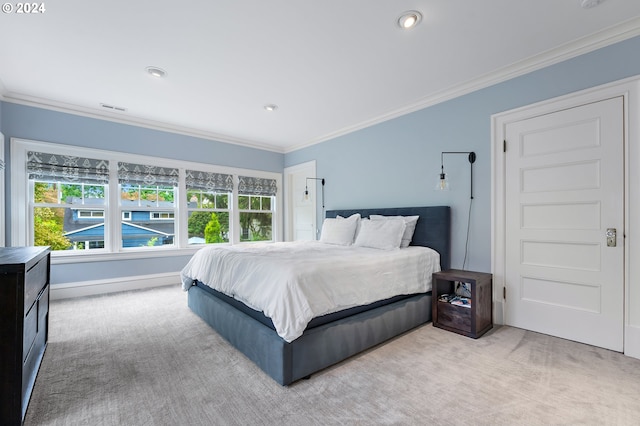 carpeted bedroom with crown molding