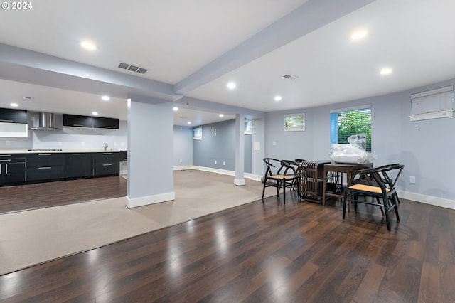 dining room featuring dark wood-type flooring and decorative columns