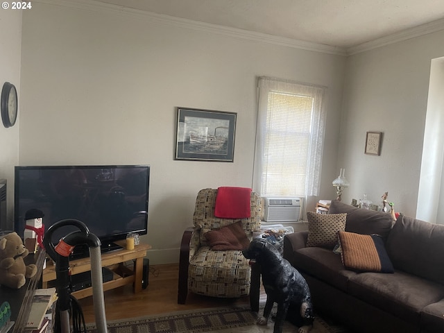 living room featuring wood-type flooring, ornamental molding, and cooling unit