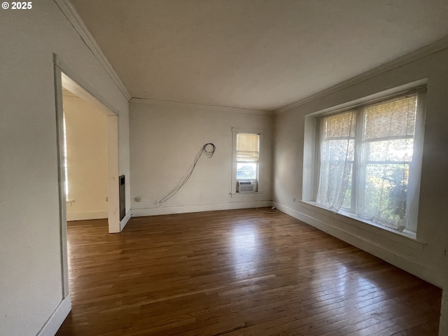 empty room with ornamental molding, hardwood / wood-style floors, and cooling unit