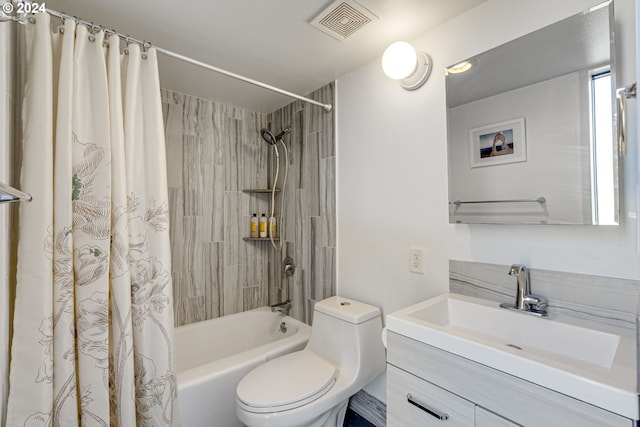 full bathroom with shower / bath combo, vanity, and toilet