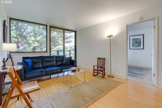 2020 SW Main St Unit 801, Portland, OR 97205 - living area featuring wood finished floors and a textured ceiling