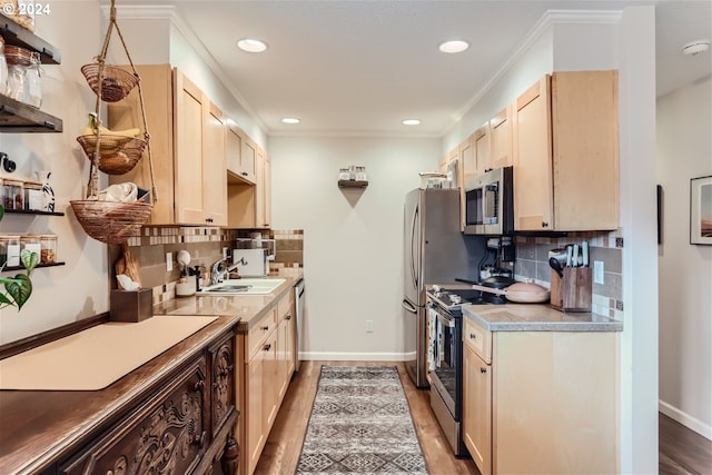 kitchen featuring decorative backsplash, stainless steel appliances, and wood-type flooring