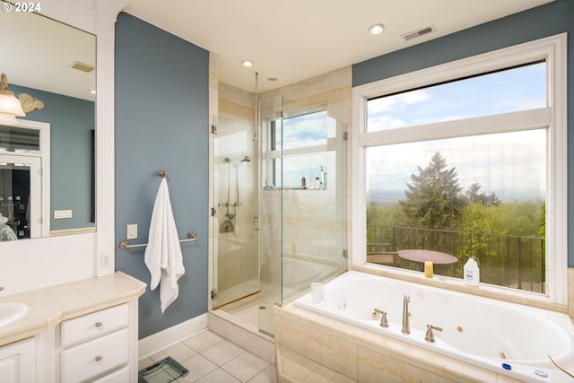 bathroom with plus walk in shower, vanity, and tile flooring