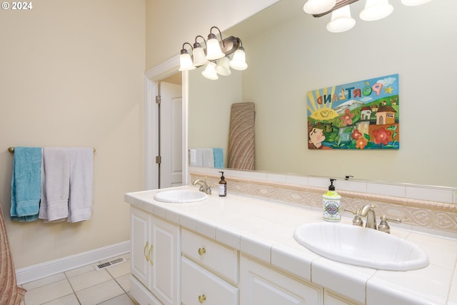 bathroom with tile flooring and double vanity