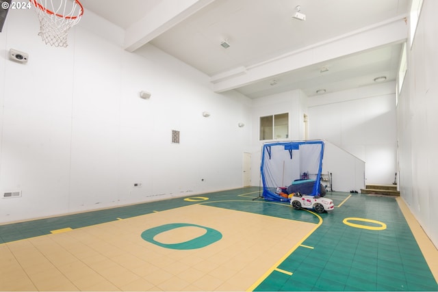 exercise area with basketball hoop and tile flooring