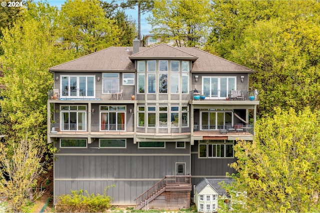 rear view of property with a balcony