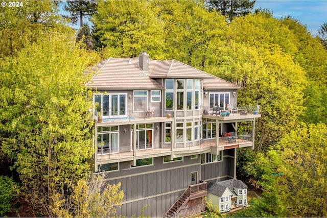 rear view of property with a balcony