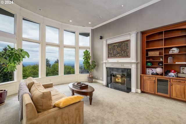 living room with light carpet, crown molding, and a tiled fireplace