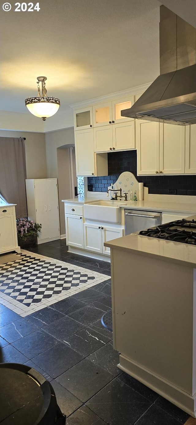 kitchen with island exhaust hood, backsplash, white cabinets, dishwasher, and dark tile patterned flooring