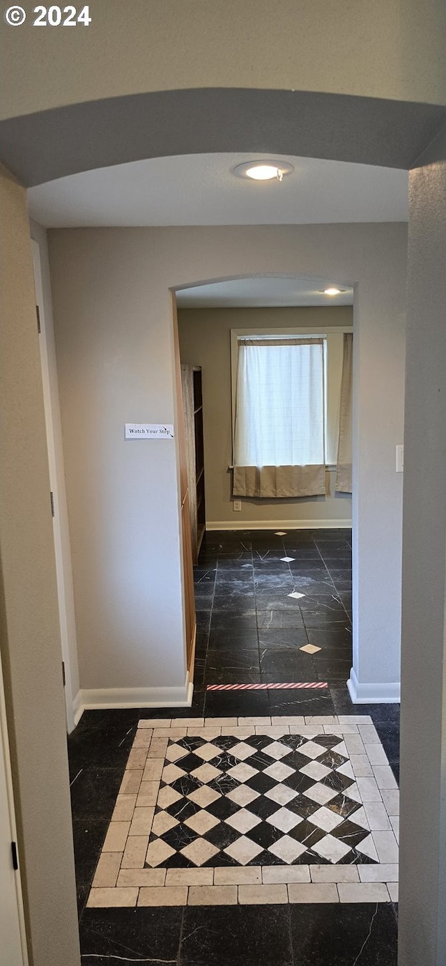 hall featuring tile patterned flooring