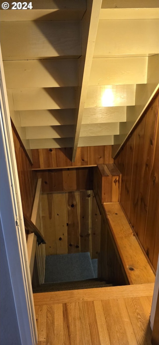 staircase featuring hardwood / wood-style flooring