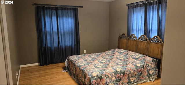 bedroom with light hardwood / wood-style floors