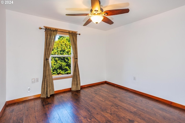 empty room featuring dark hardwood / wood-style floors and ceiling fan