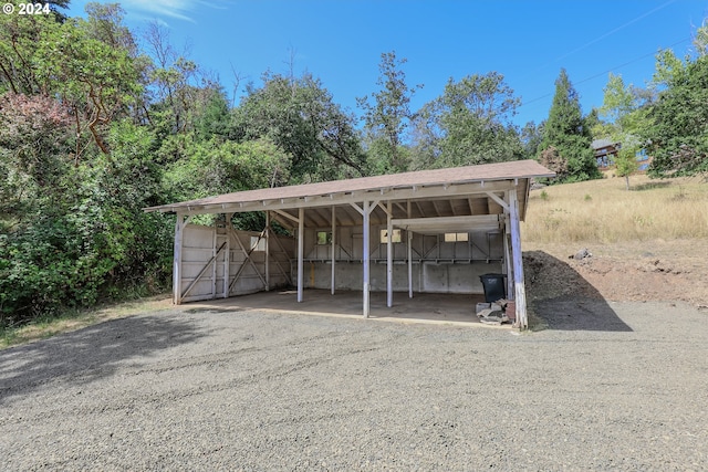 view of parking with a detached carport