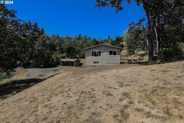 exterior space featuring a wooden deck