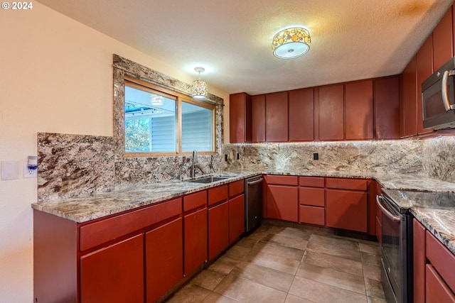 kitchen with sink, decorative backsplash, a textured ceiling, light tile patterned flooring, and stainless steel appliances