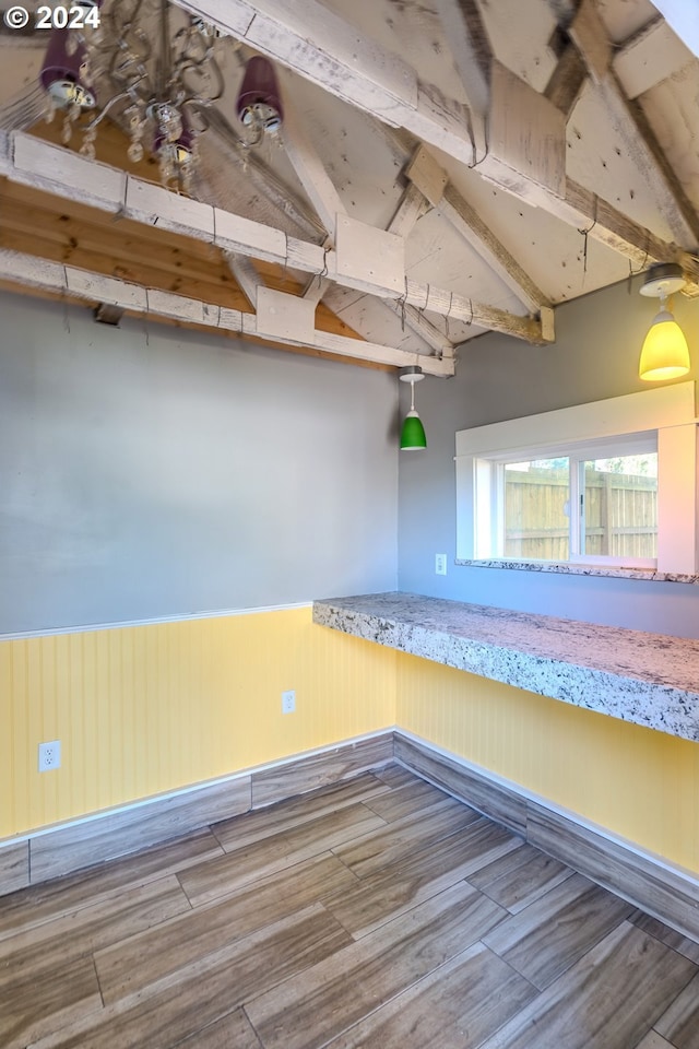 interior space featuring wooden walls and wood-type flooring